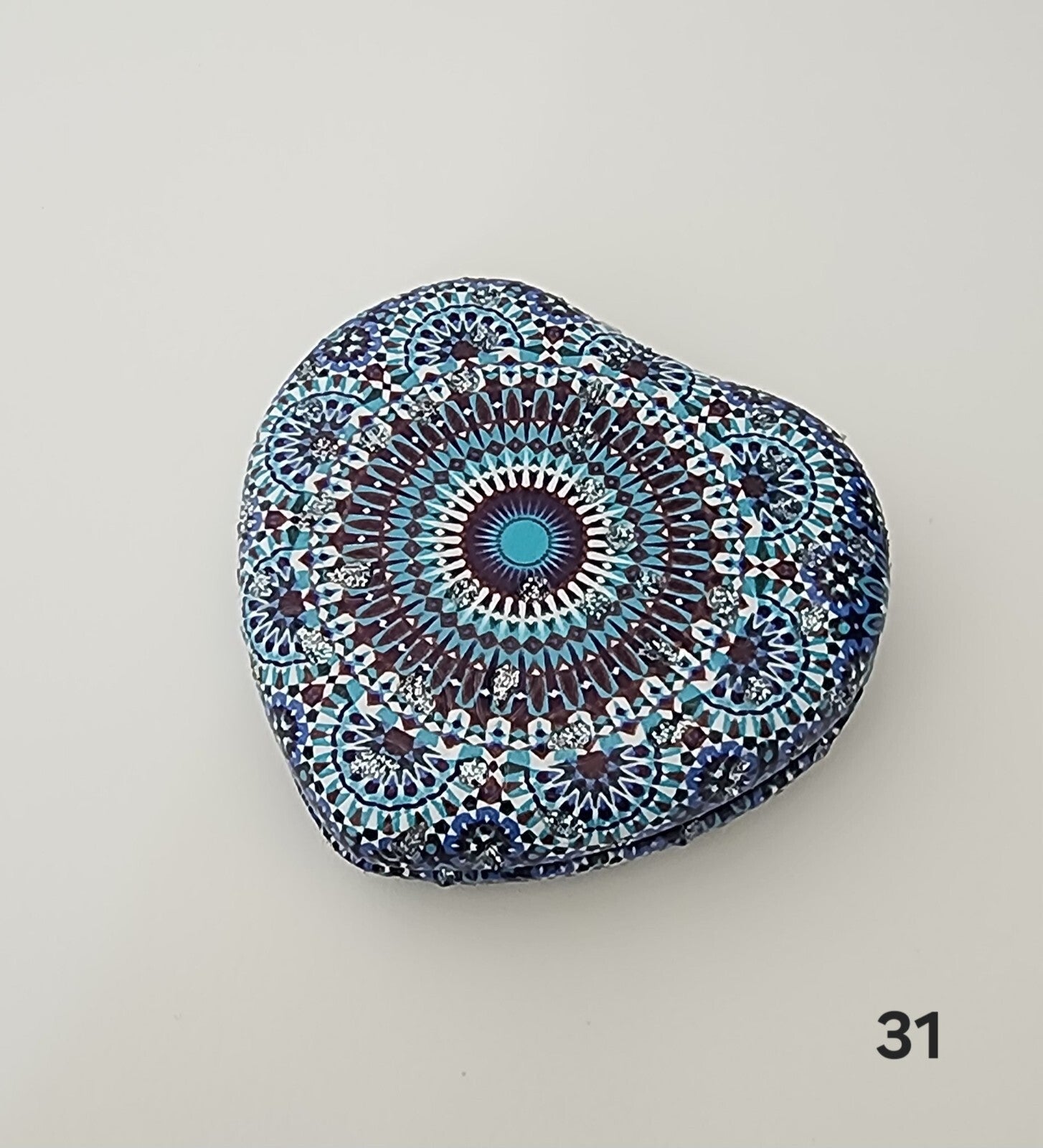 Authentic Moroccan women's multi-shaped/multi-sized mirrors for outdoor use.