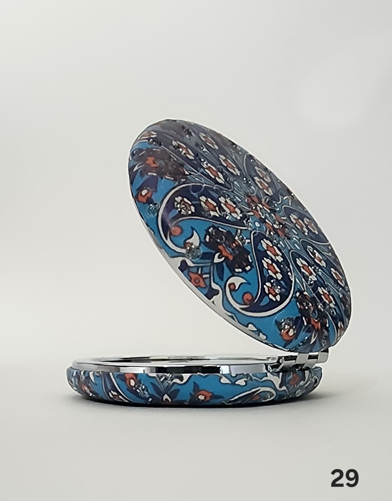 Authentic Moroccan women's multi-shaped/multi-sized mirrors for outdoor use.