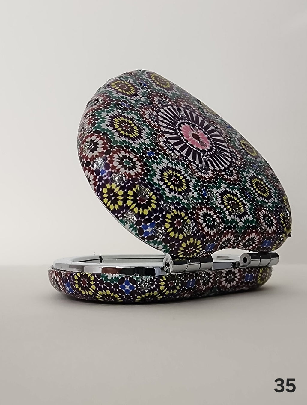 Authentic Moroccan women's multi-shaped/multi-sized mirrors for outdoor use.