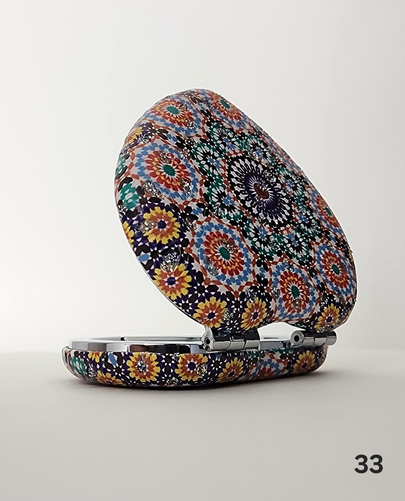 Authentic Moroccan women's multi-shaped/multi-sized mirrors for outdoor use.